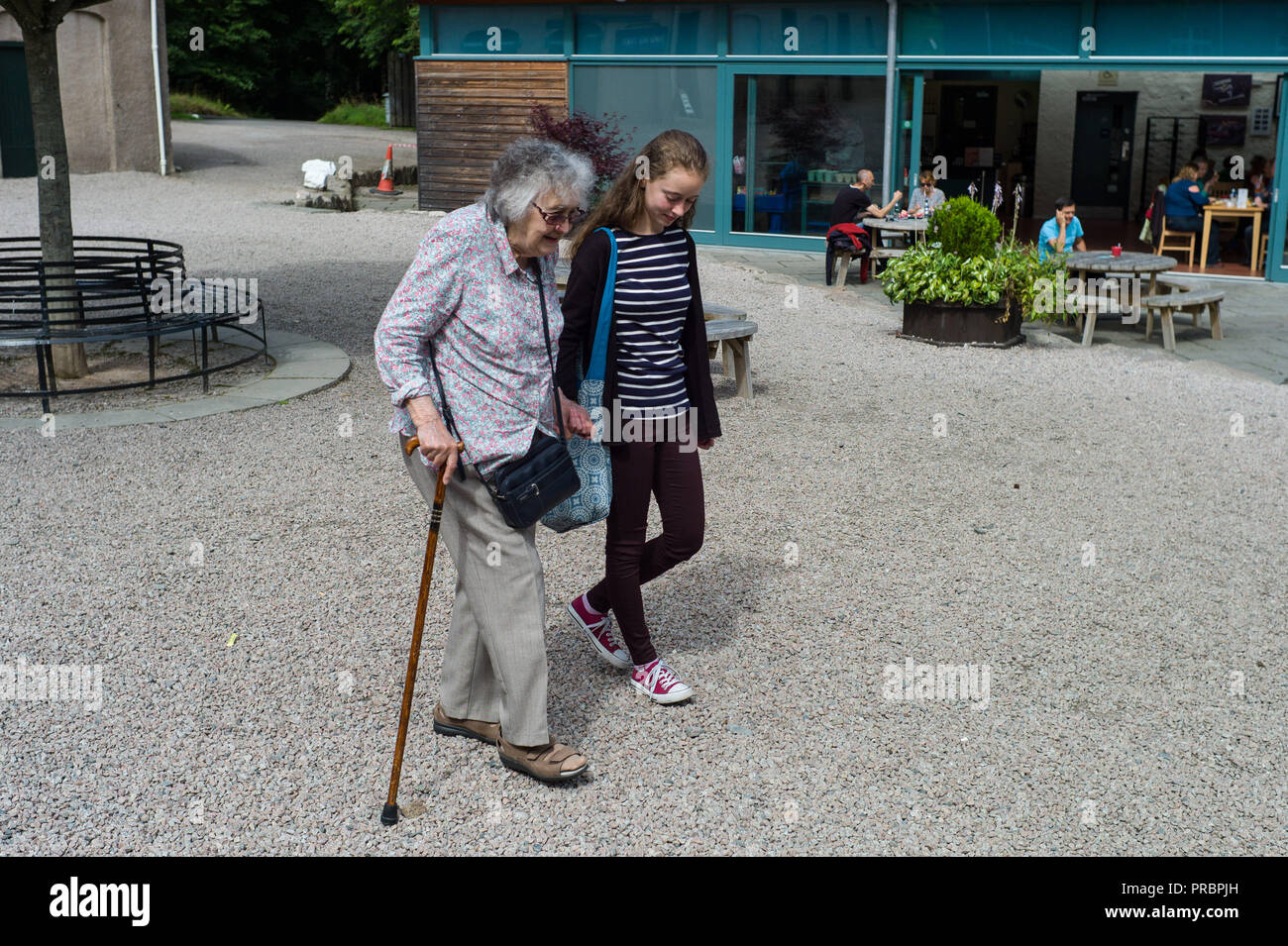 Old woman walking stick hi-res stock photography and images - Alamy