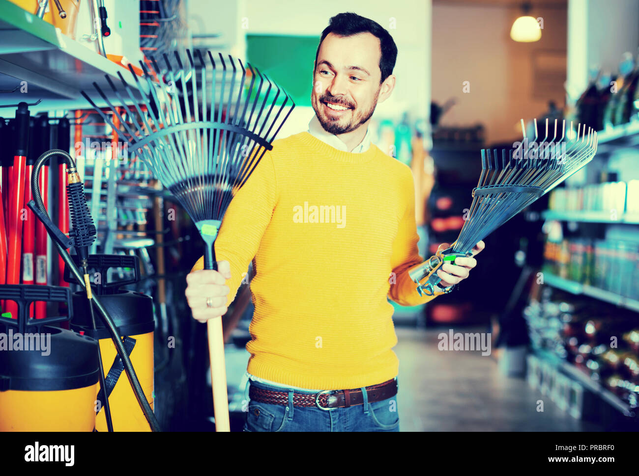 Cheerful man various tools hi-res stock photography and images - Alamy