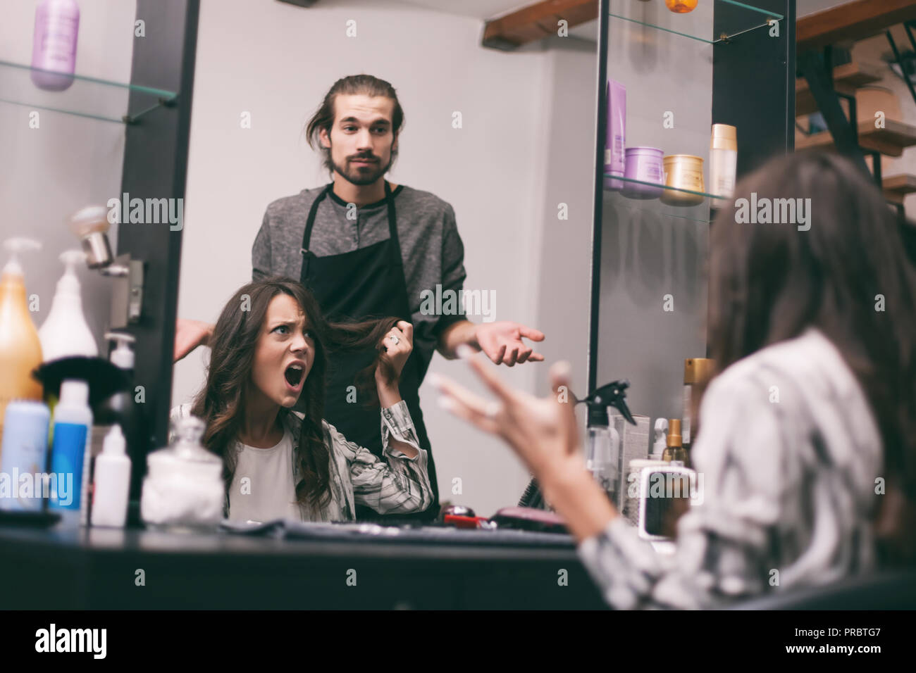 Young Woman Getting New Hairstyle At Professional Hair Styling