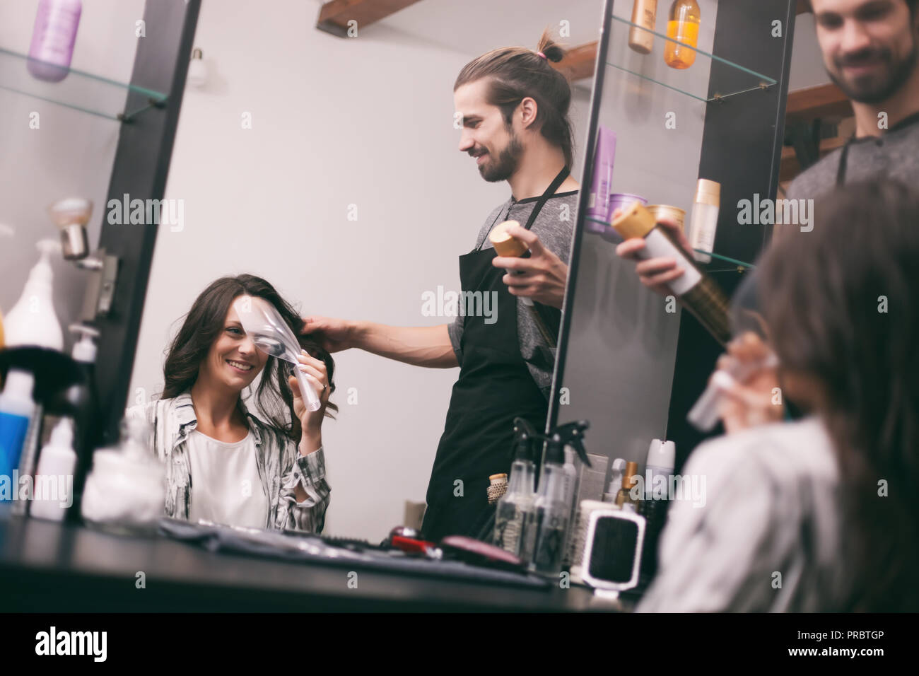 Young Woman Getting New Hairstyle At Professional Hair Styling