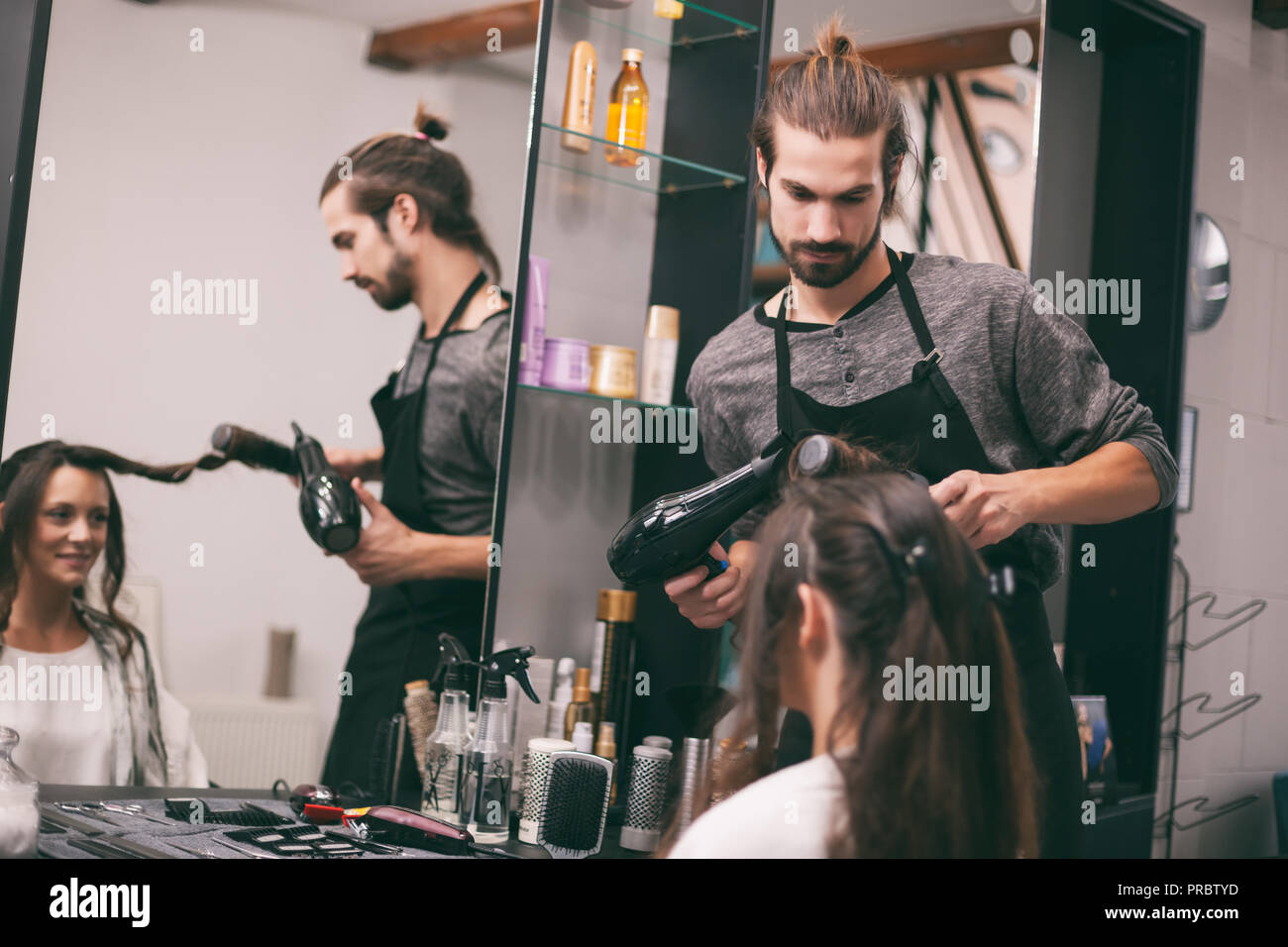 Young Woman Getting New Hairstyle At Professional Hair Styling