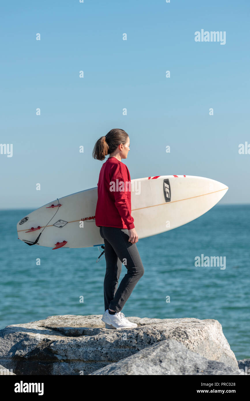 Female surfer holding surfboard hi-res stock photography and images - Alamy