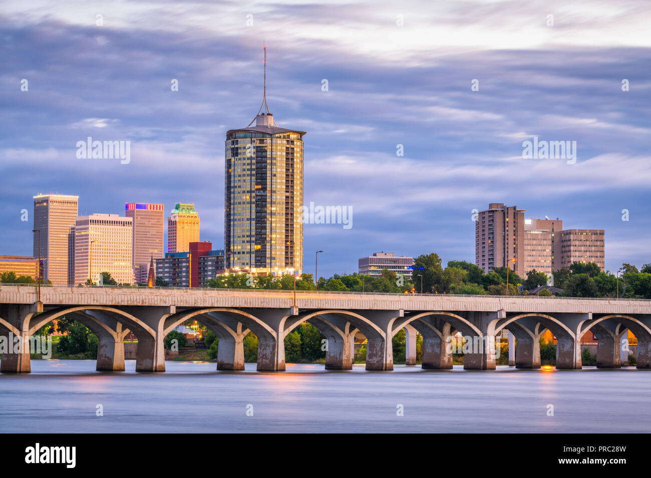 Tulsa, Oklahoma, USA downtown skyline on the Arkansas River at dusk