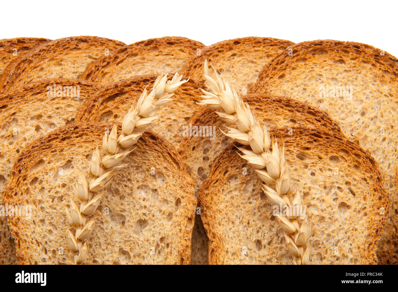 toast in slices and two ears of wheat Stock Photo