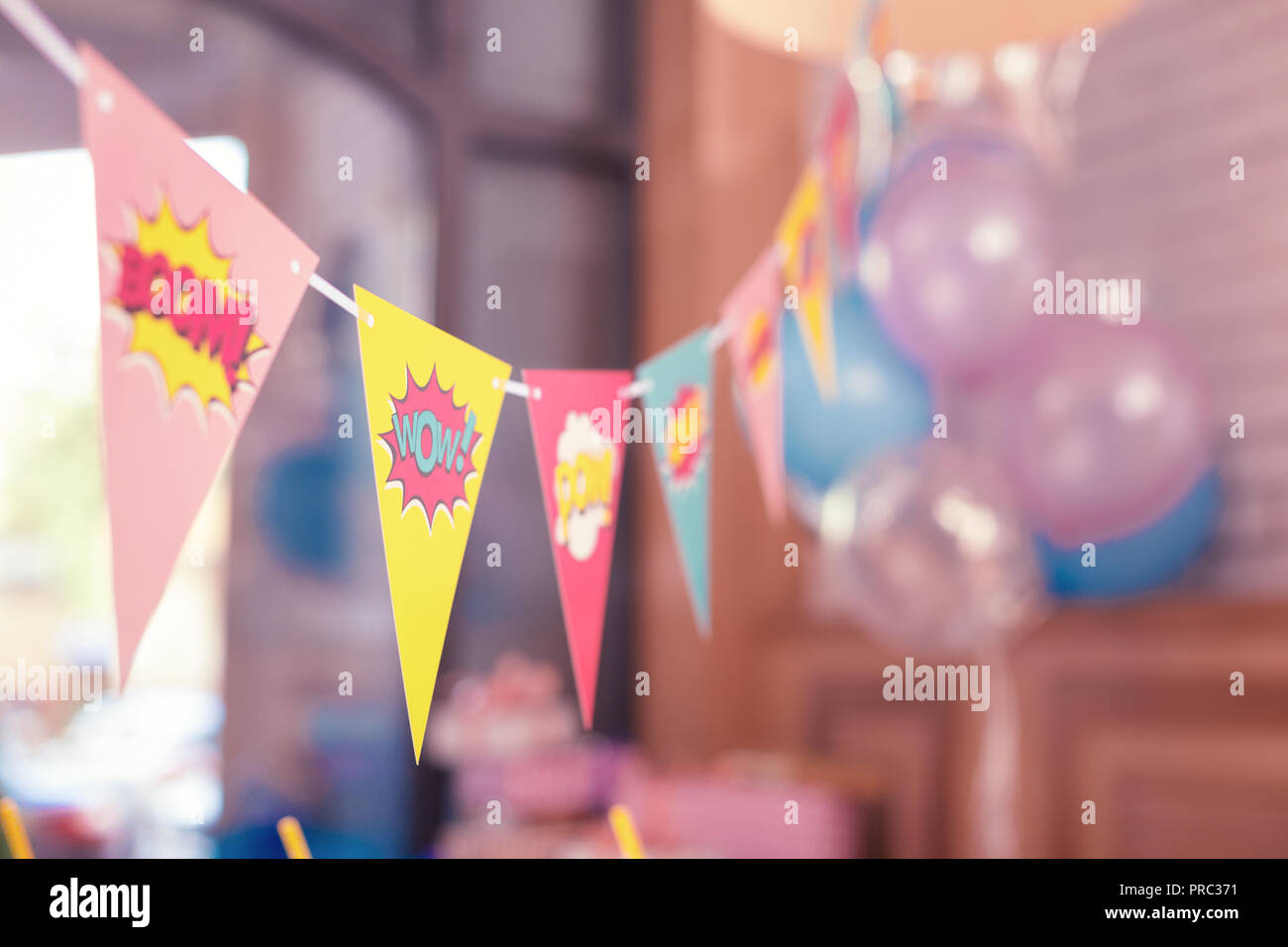 Bright laconic flags placed in the room for the party Stock Photo