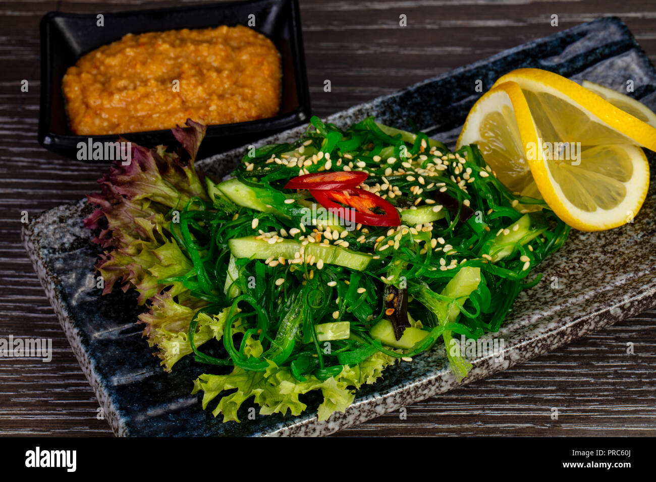 Bright green kaiso salad with lemon Stock Photo Alamy