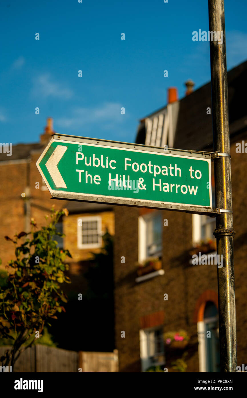 Sign post indicating the public footpath to the hill and harrow Stock