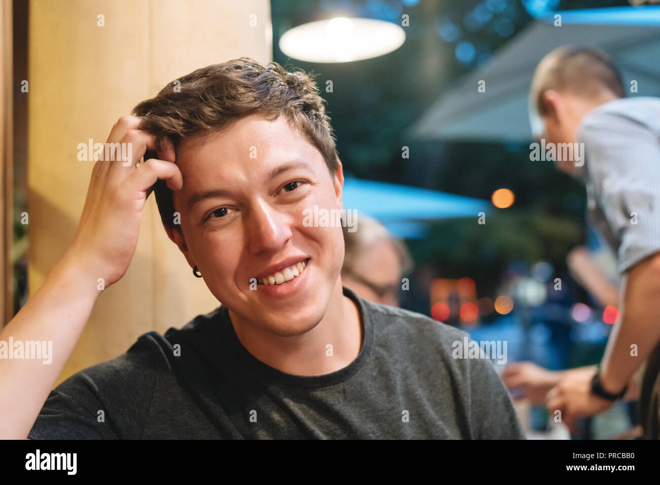The guy in the evening restaurant. Stock Photo