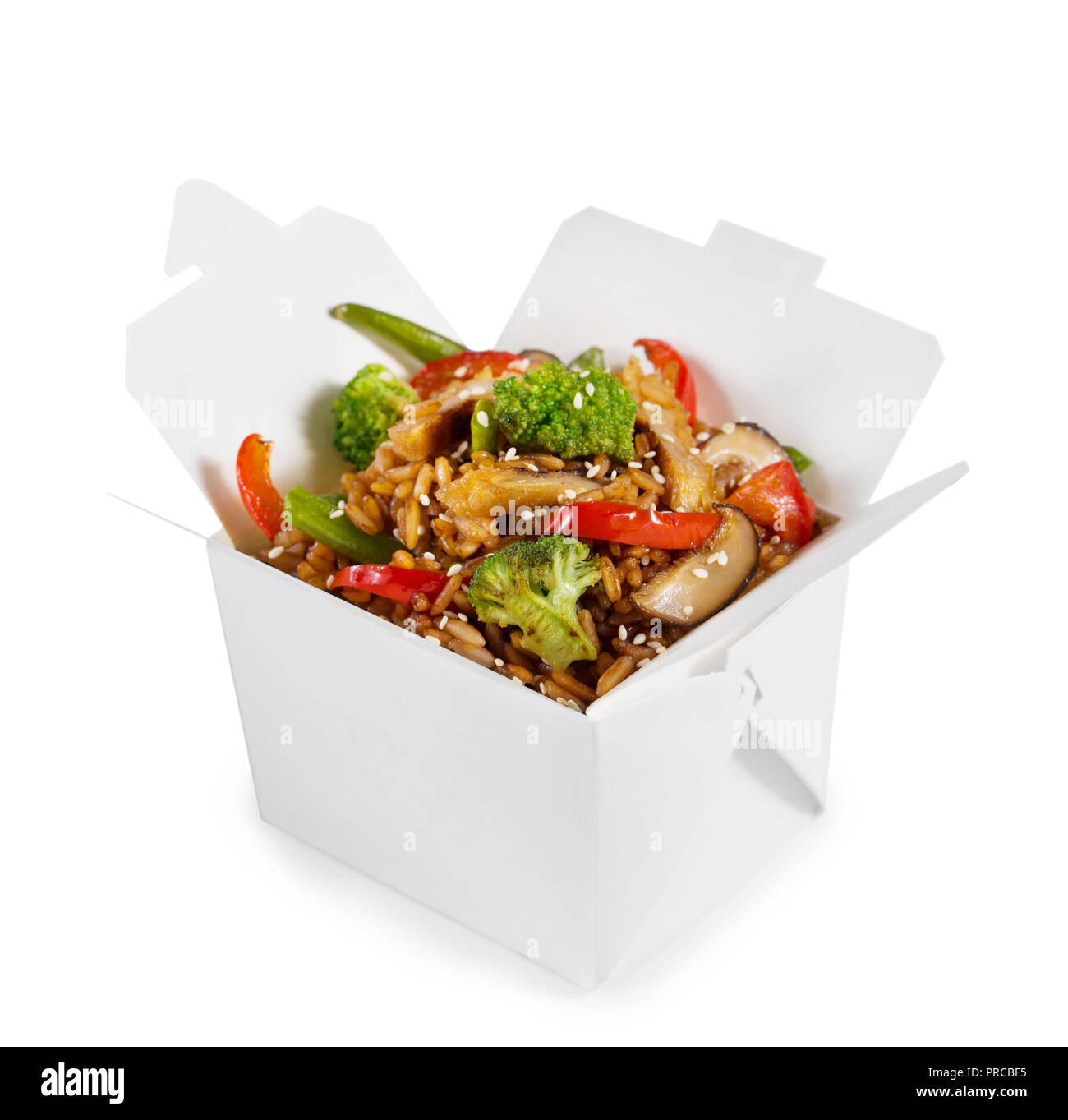 Rice with vegetables and mushrooms in a paper box isolated on a white ...