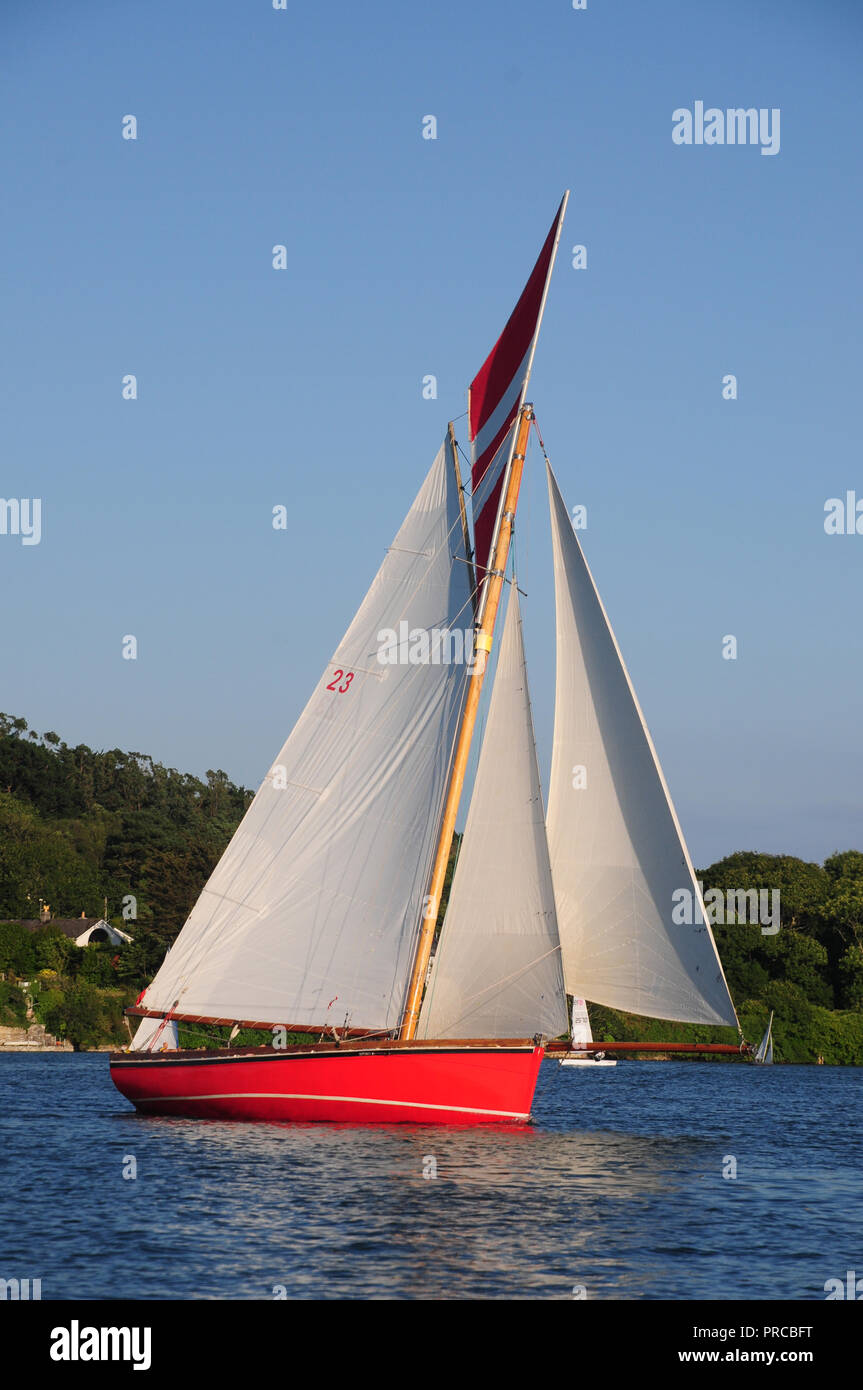 Traditional Falmouth working boat under sail in the Fal estuary Stock