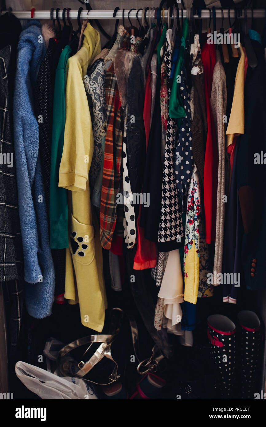 Colorful clothing in wardrobe in fashionable store Stock Photo Alamy