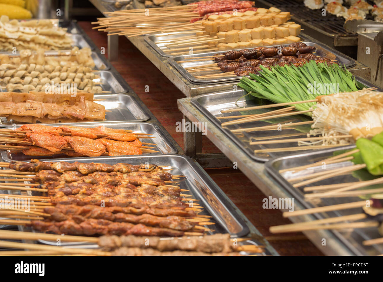 Street food asia. Street food on a stick Stock Photo - Alamy