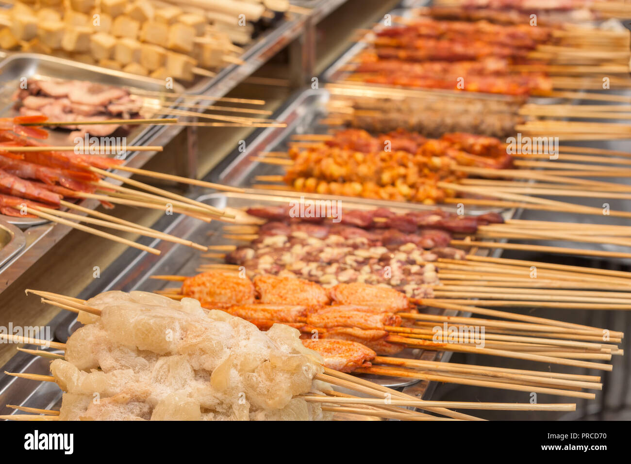 Street food asia. Street food on a stick Stock Photo - Alamy