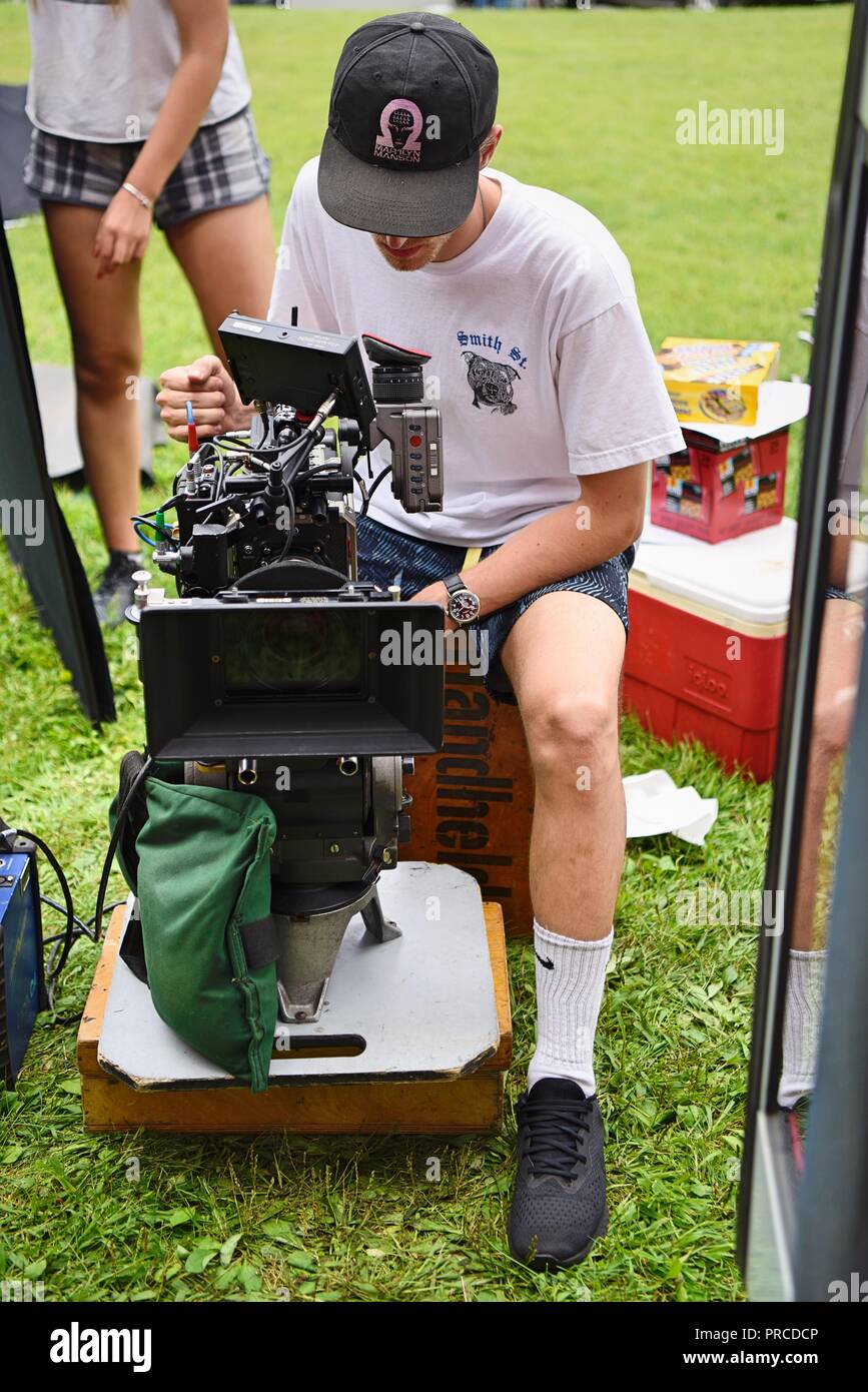 New York, NY; Aug 2018: A cinematographer frames up his shot Stock Photo