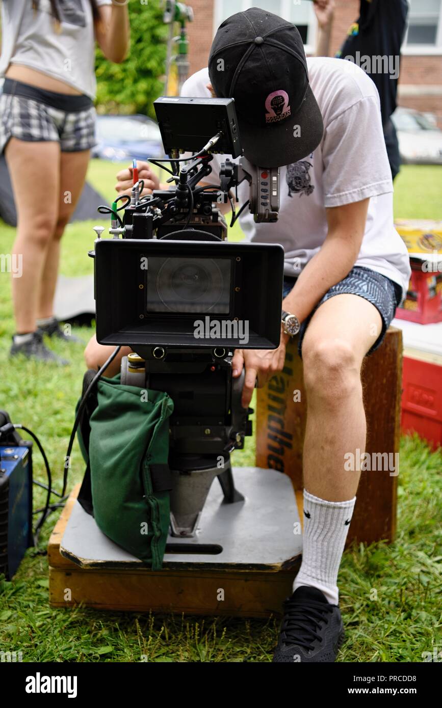New York, NY; Aug 2018: A cinematographer peers through his view finder to set up his shot Stock Photo