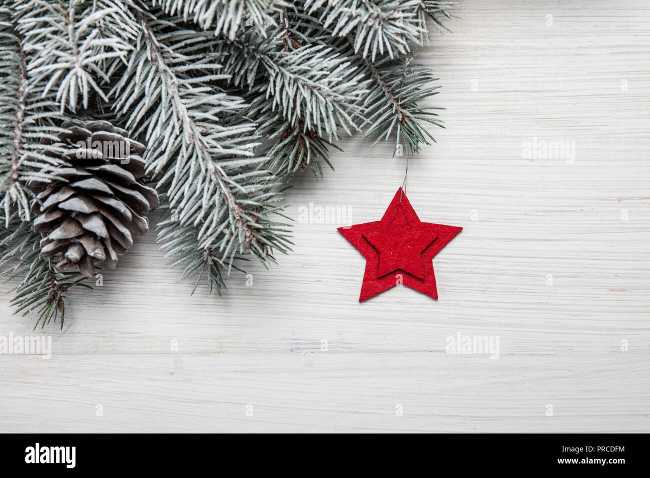 Christmas wooden background with snow fir tree and decoration. Top view ...