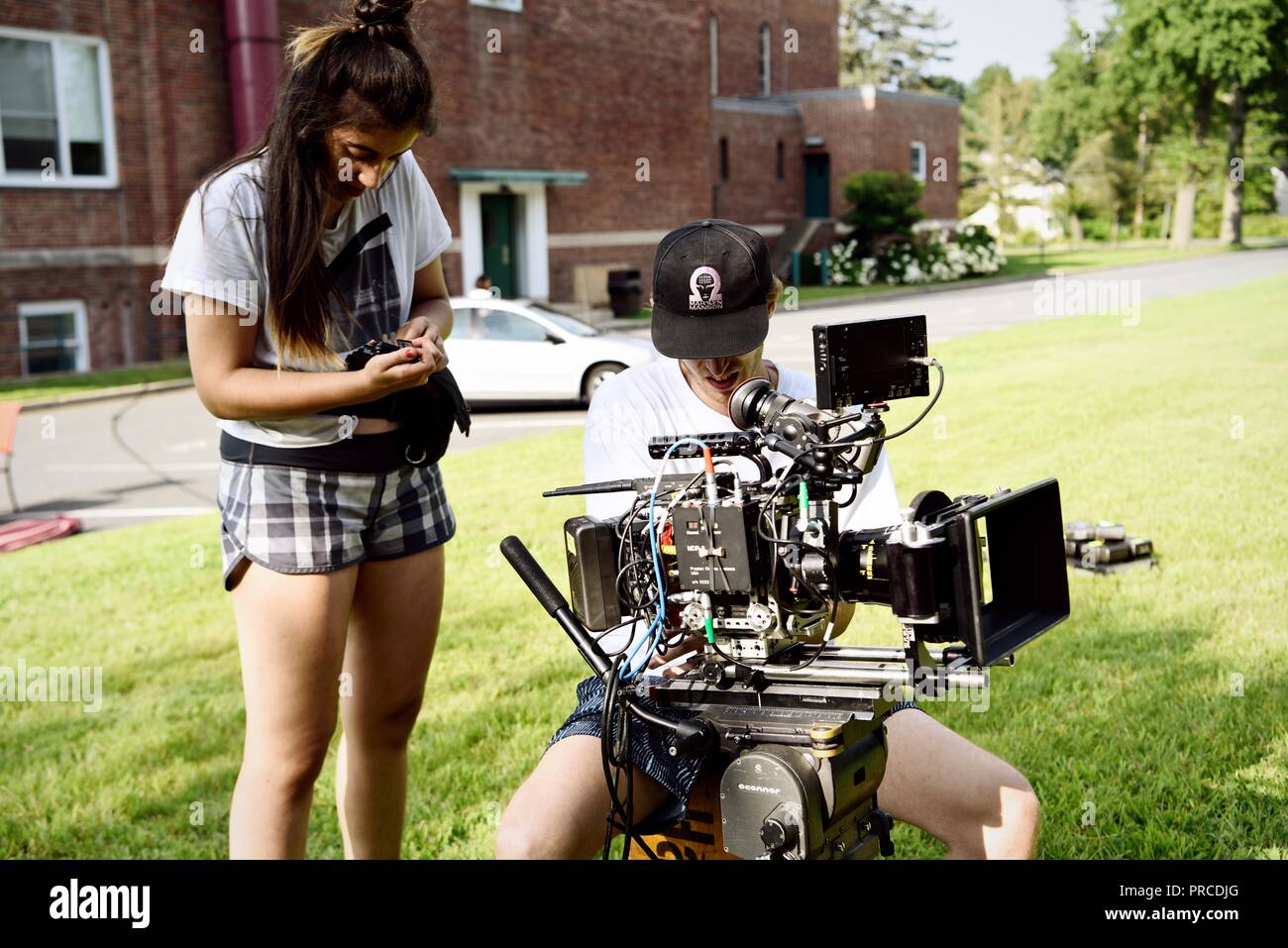 New York, NY; Aug 2018: A cinematographer and his assistant work with their camera rig on a film set Stock Photo