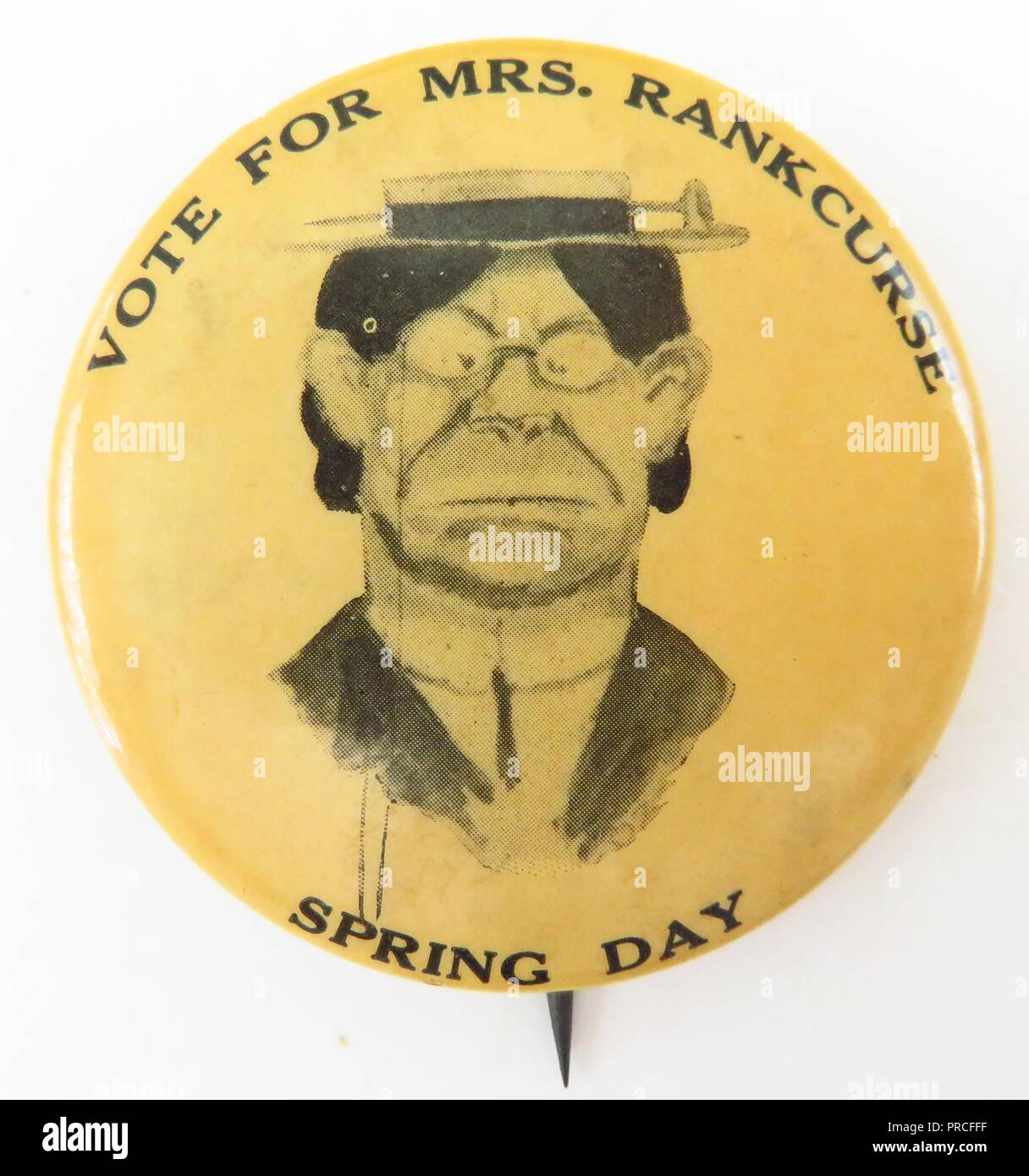 Black and cream anti-suffrage pin, with a caricature of the English, militant suffrage leader, Emmeline Pankhurst, and with the text 'Vote For Mrs Rankcurse, Spring Day, ' manufactured for the American market, likely in conjunction with one of Mrs Pankhurst's visits to the United States, 1915. Photography by Emilia van Beugen. () Stock Photo