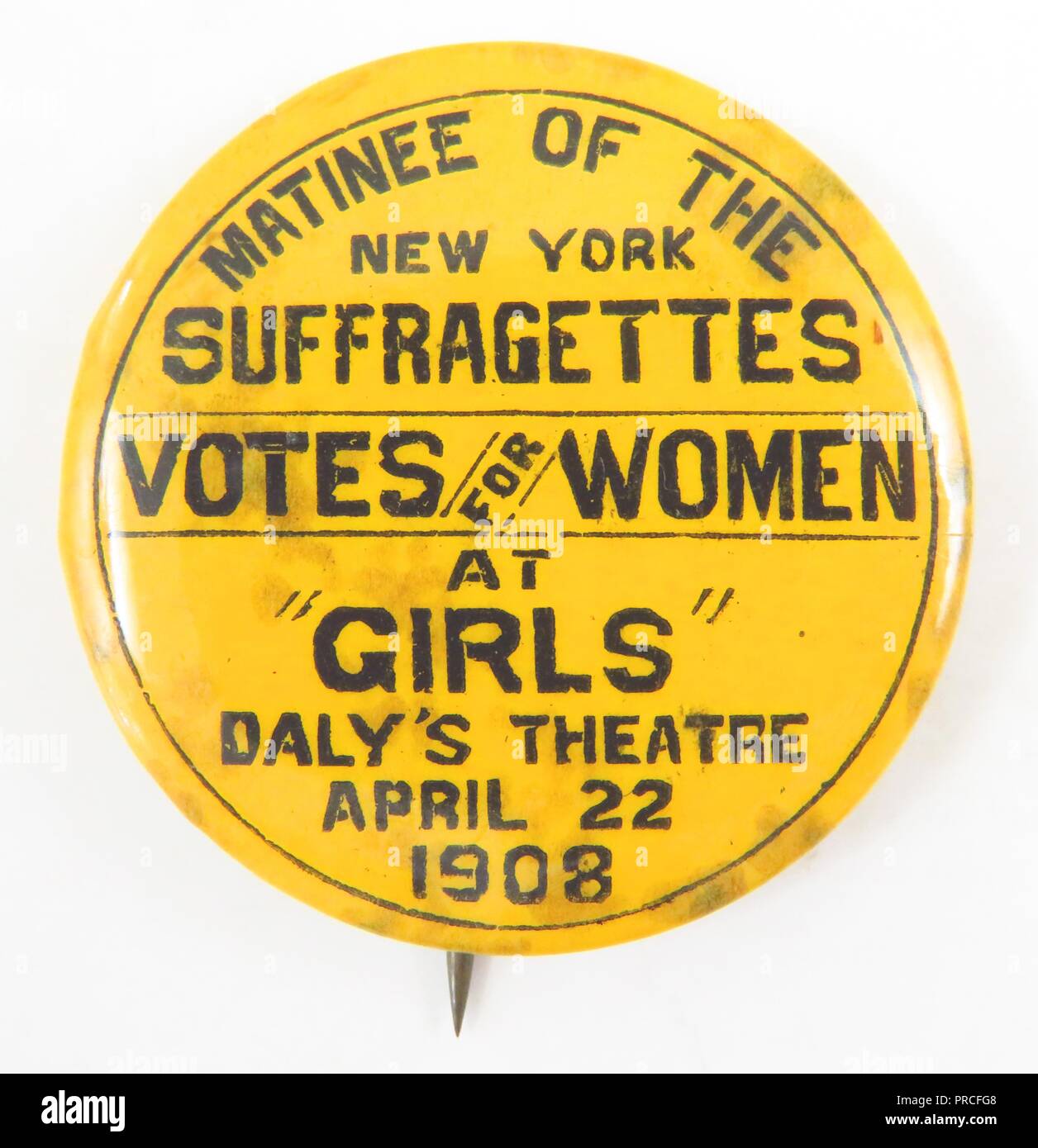 Yellow and black suffrage-era pin, manufactured for the American market, to advertise a dramatic production called The Suffragettes, opening at Daly's Theatre in New York City, 1908. Photography by Emilia van Beugen. () Stock Photo