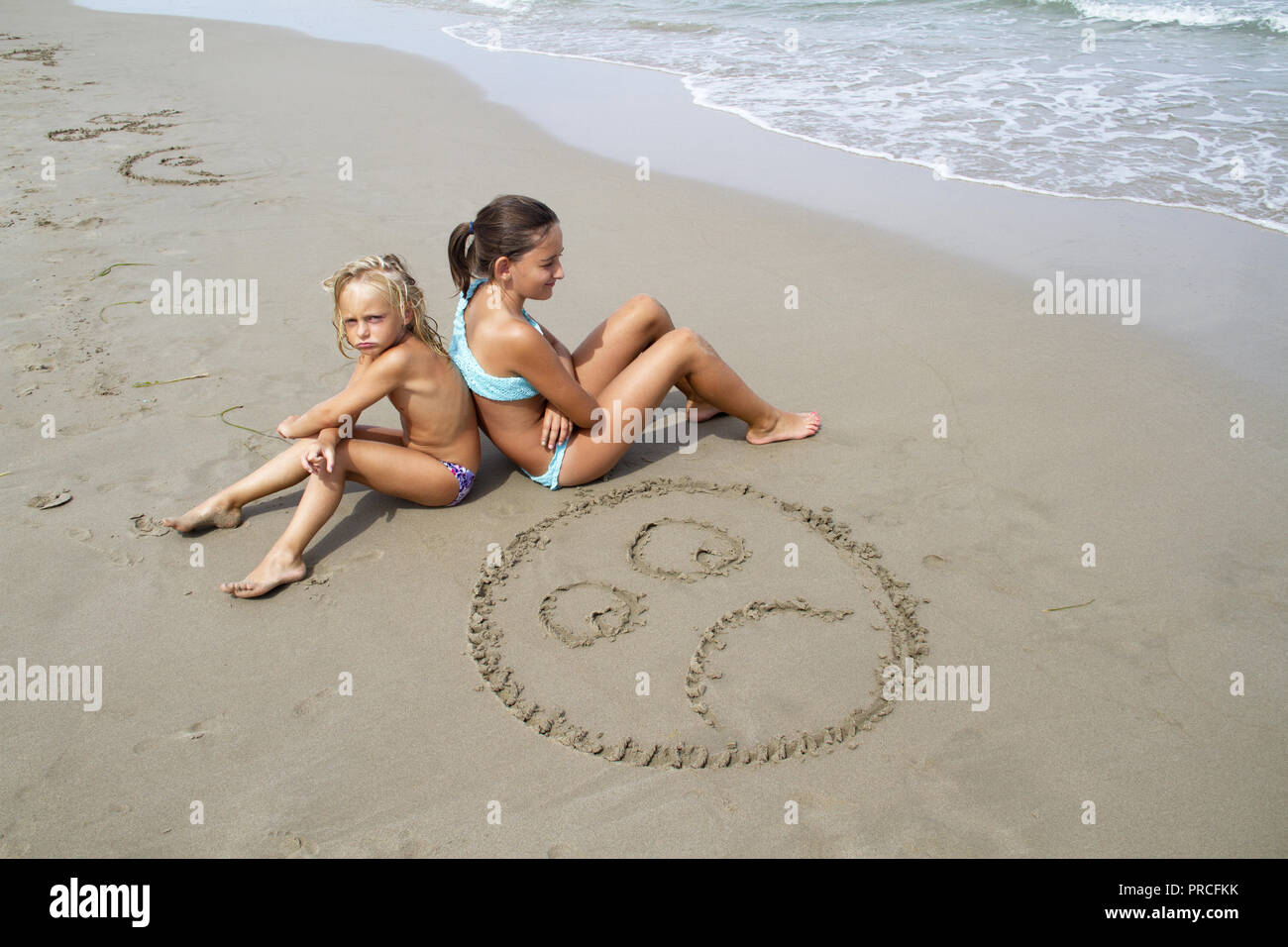 angry girls on the beach Stock Photo - Alamy