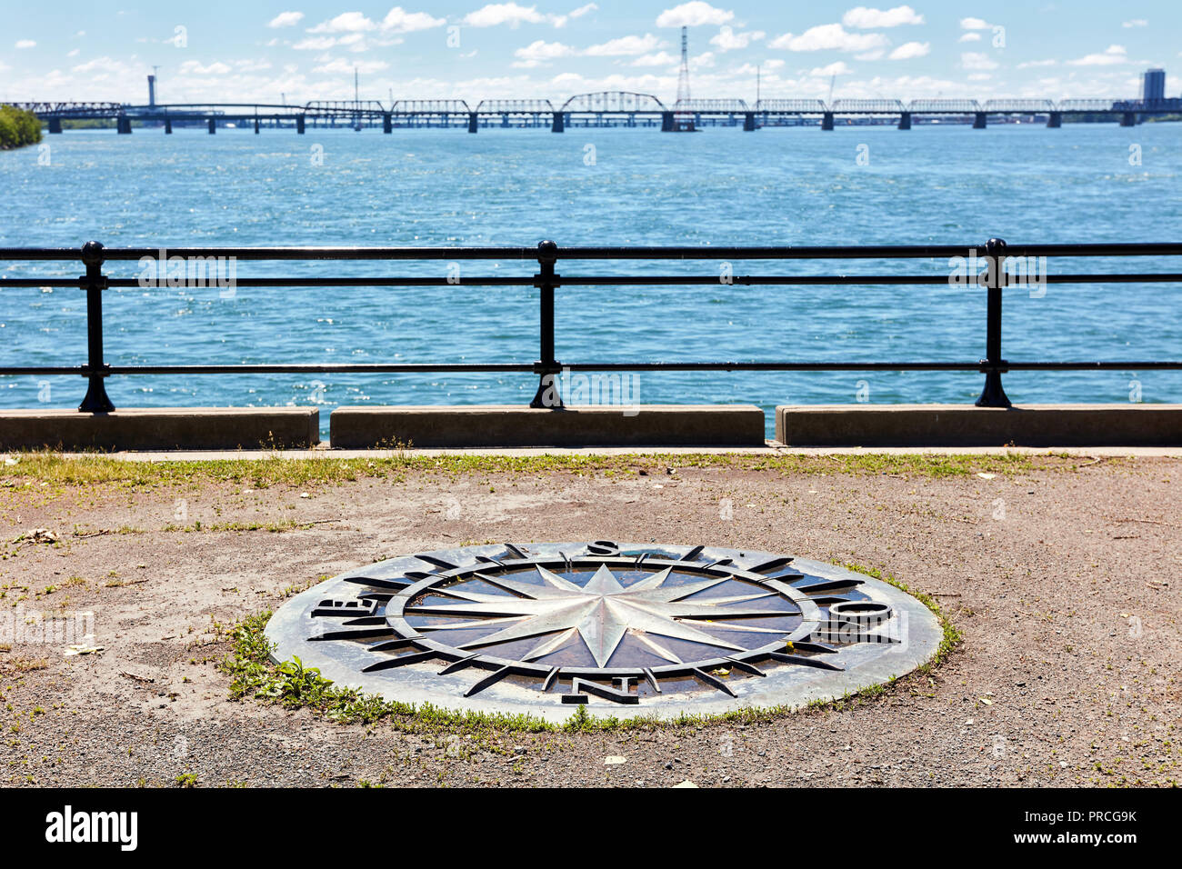 Wind rose compass on saint Helen island, saint Lawrence river and Jacques cartier bridge in