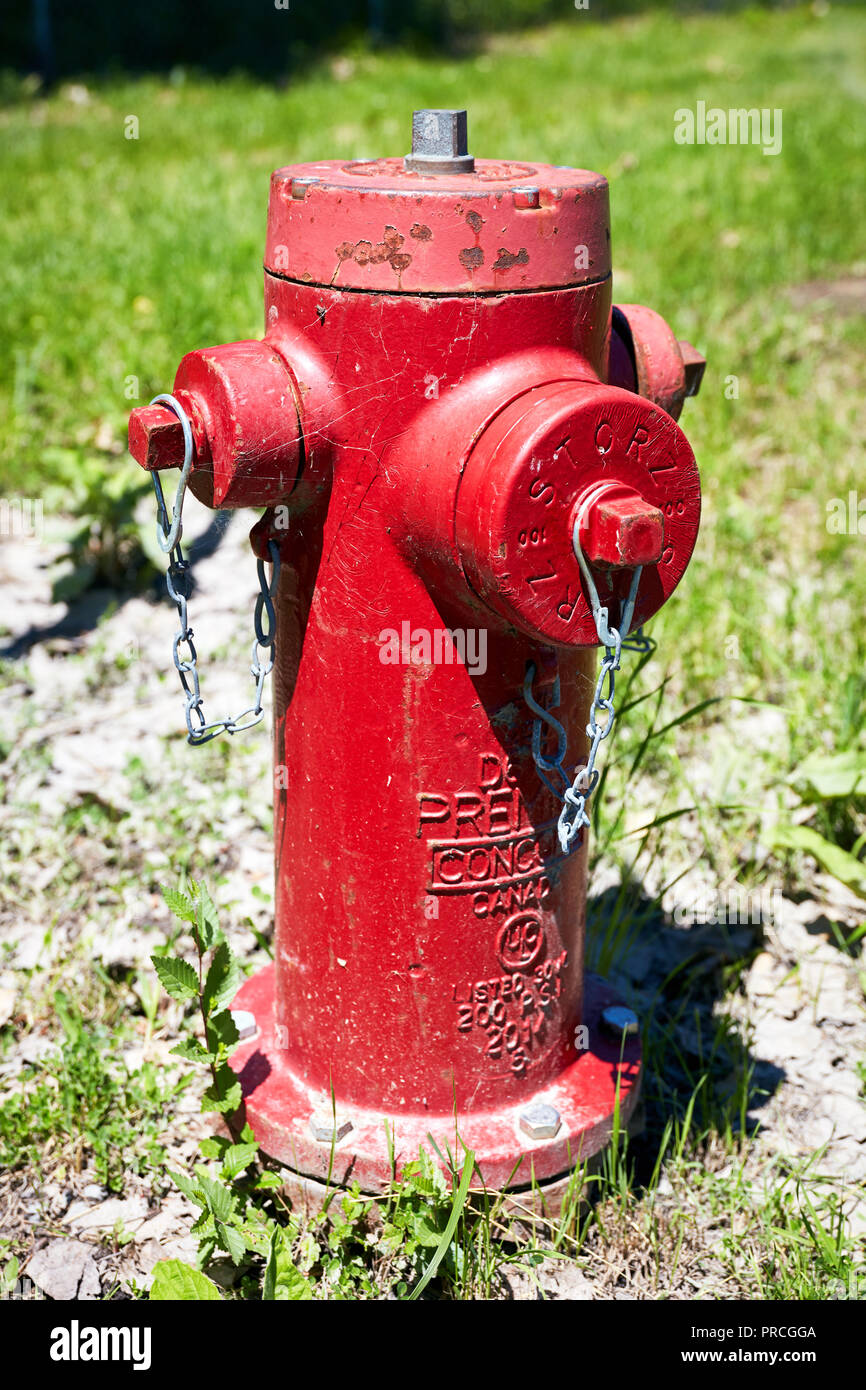 Red fire hydrant of Montreal city, Quebec, Canada on a bright sunny day