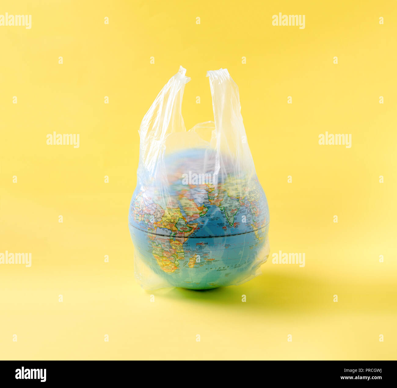 globe model in plastic bag, save the world environment Stock Photo