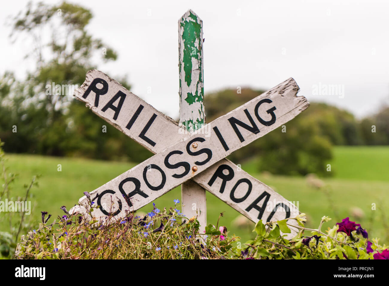 Railroad crossing sign at the restored section of the Great Northern Railway (Ireland) at Glaslough, County Monaghan, Ireland. Stock Photo