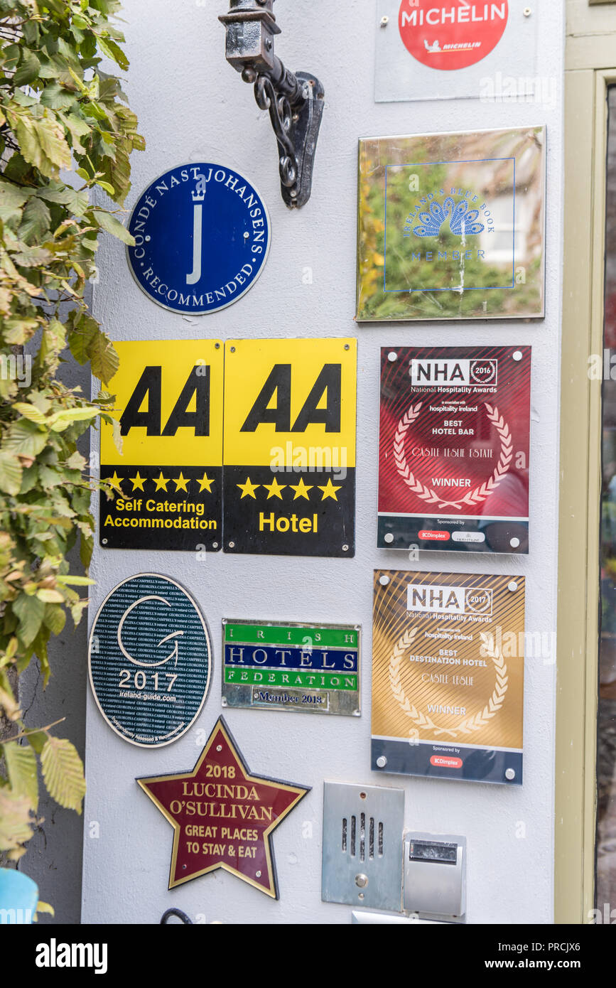 Numerous quality award plaques at the entrance to a fine dining restaurant. Stock Photo