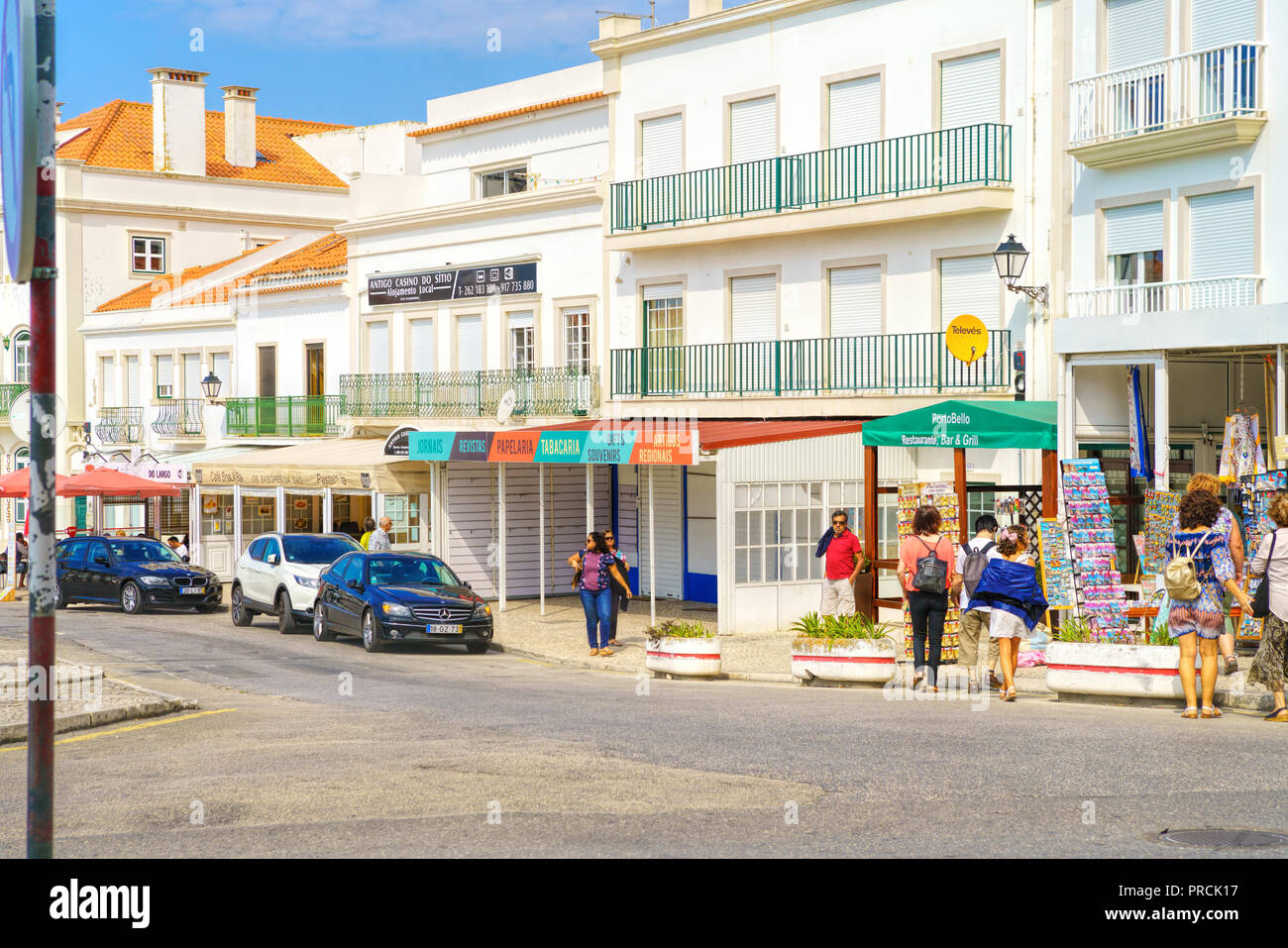 View of the central street and square with traditional shops at picturesque seaside village Nazare Stock Photo