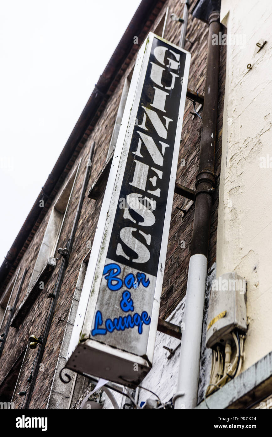 Very old Guinness sign at a Bar and Lounge, Monaghan Town, County Cavan, Ireland. Stock Photo