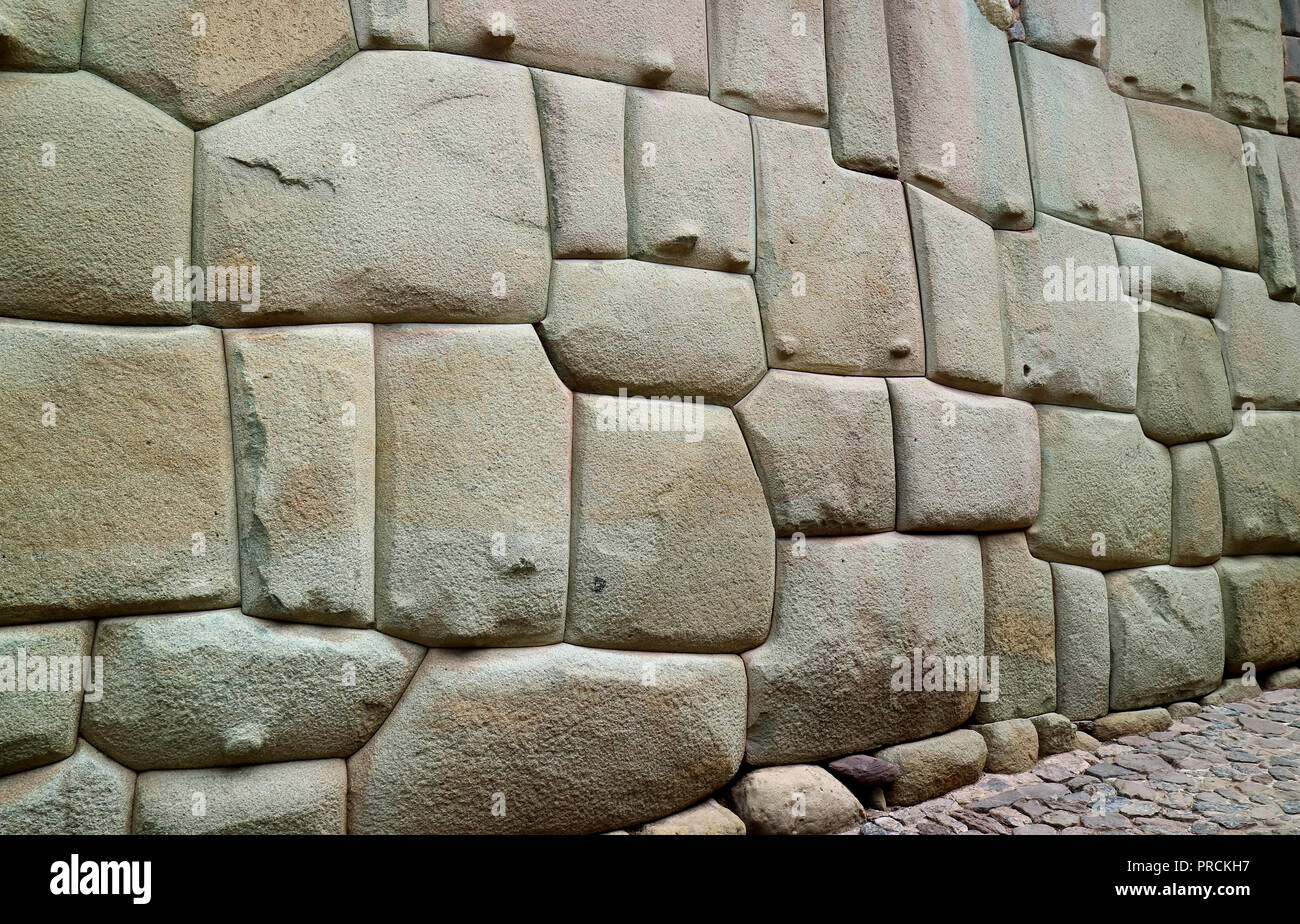 Incredible Inca Wall on Hatun Rumiyoc Street, Famous Ancient Street in Cusco, Peru, South America, Archaeological site Stock Photo