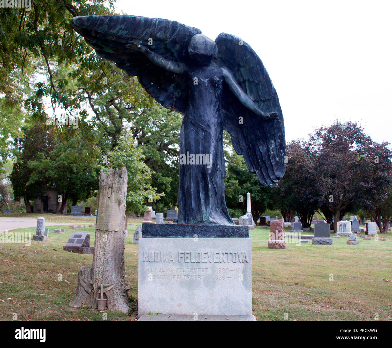 The Black Angel memorial at Oakland Cemetery, Iowa City—an eerie bronze statue turned dark, rich with local legend and lore. Stock Photo