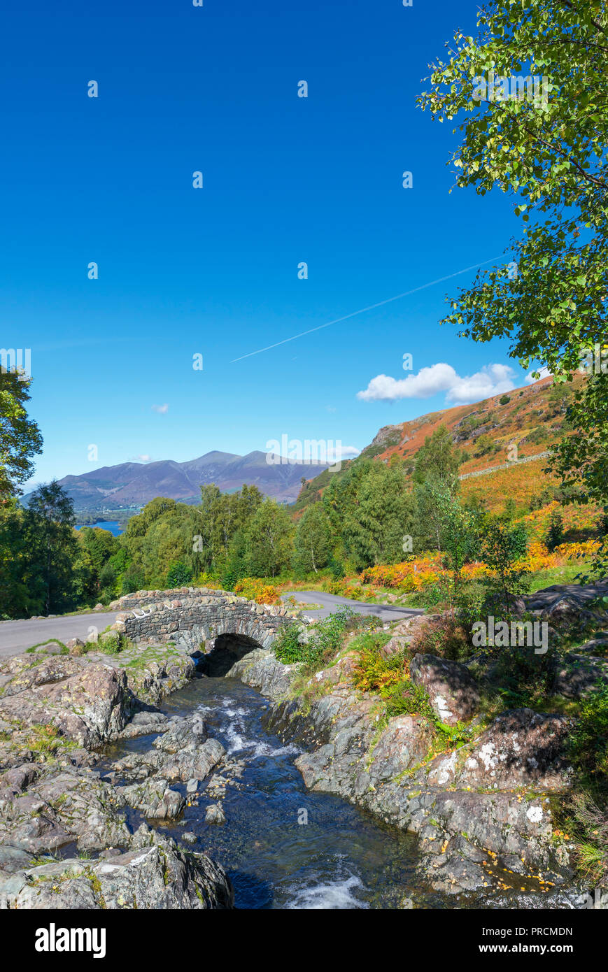 Ashness Bridge with Skiddaw massif in the distance, Borrowdale, Lake District, Cumbria, UK Stock Photo