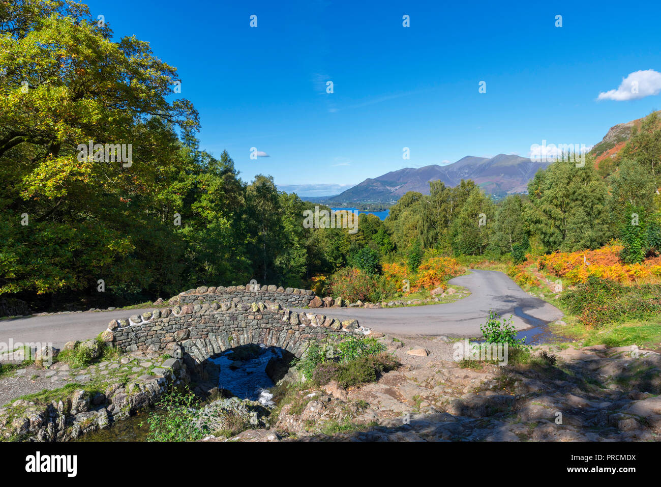 Ashness Bridge with Skiddaw massif in the distance, Borrowdale, Lake District, Cumbria, UK Stock Photo