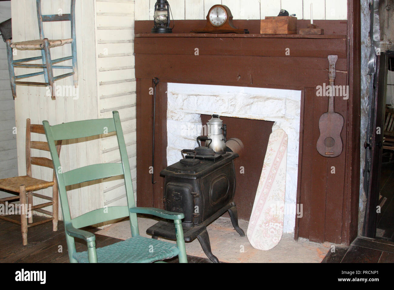 Simple room with wood stove in historical mountain house in Virginia's Blue Ridge Parkway. Johnson Farm, 1930. Stock Photo