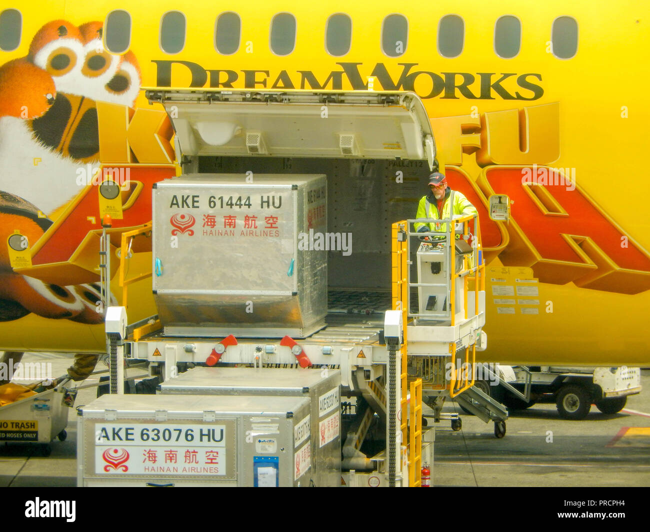 SEATTLE, WA - JUNE 2019: Air freight pallet being loaded into the cargo hold of a Hainan Airlines Boeing 787 Dreamliner at Seattle Tacoma airport. Stock Photo