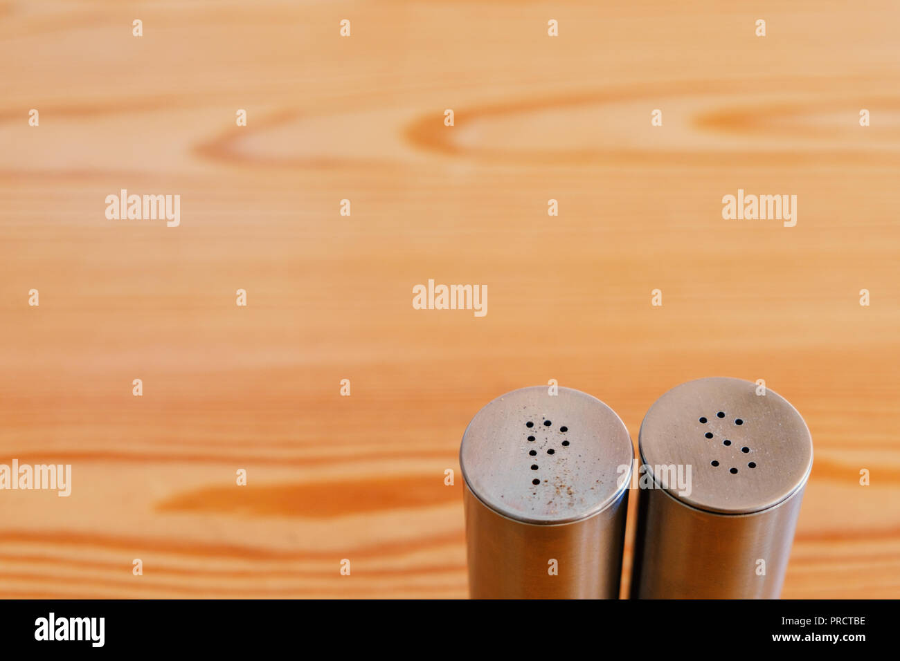 Salt and pepper shakers on light grey table, closeup. Space for text Stock  Photo - Alamy