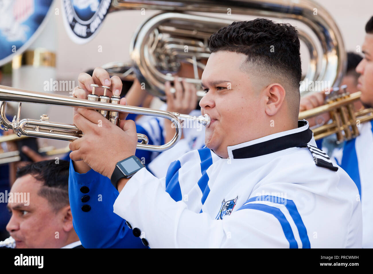 Hispanic (Salvadoran / Salvadorian) trumpet player in marching band - USA Stock Photo