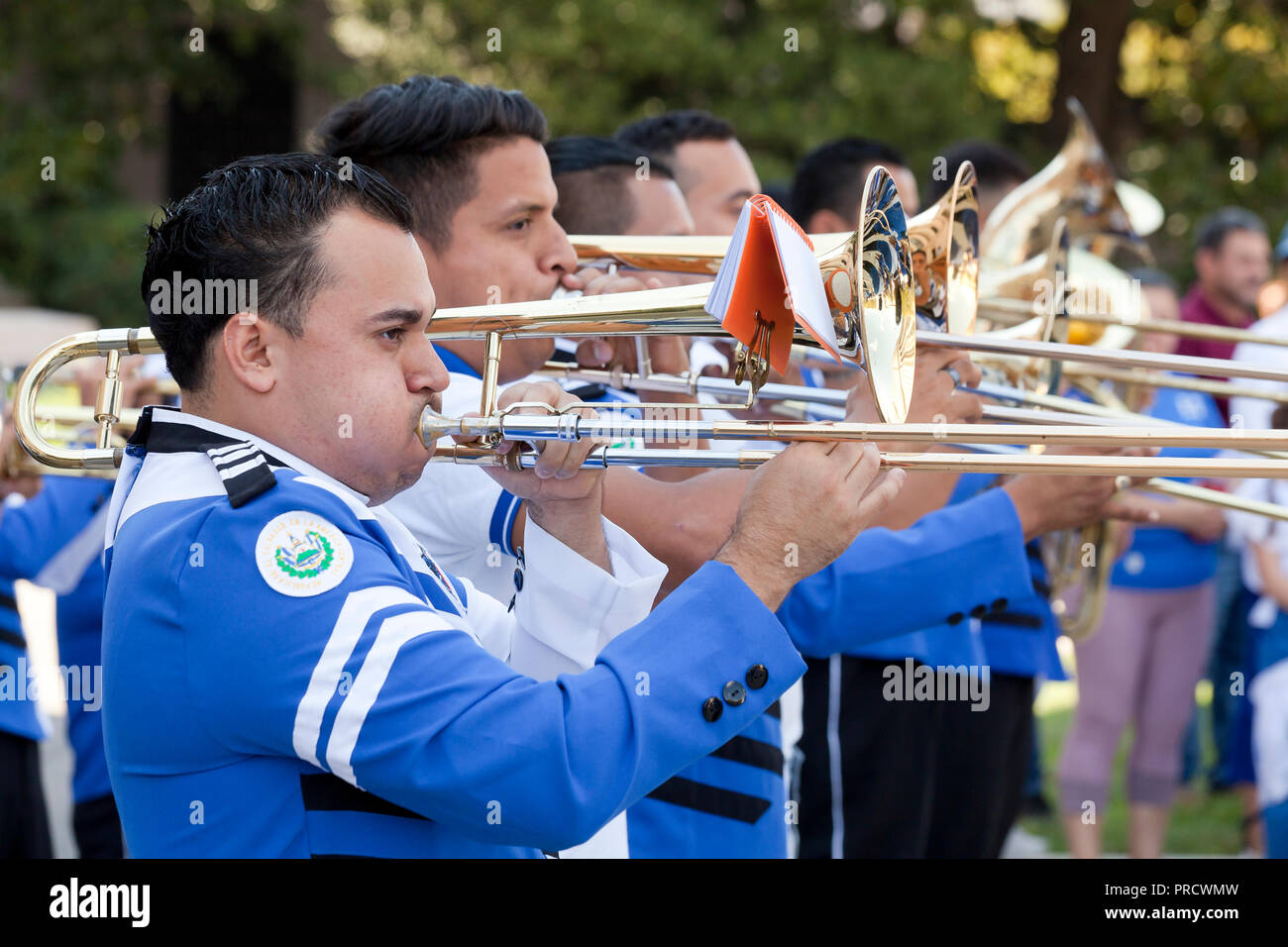 Hispanic (Salvadoran / Salvadorian) trombone player in marching band - USA Stock Photo