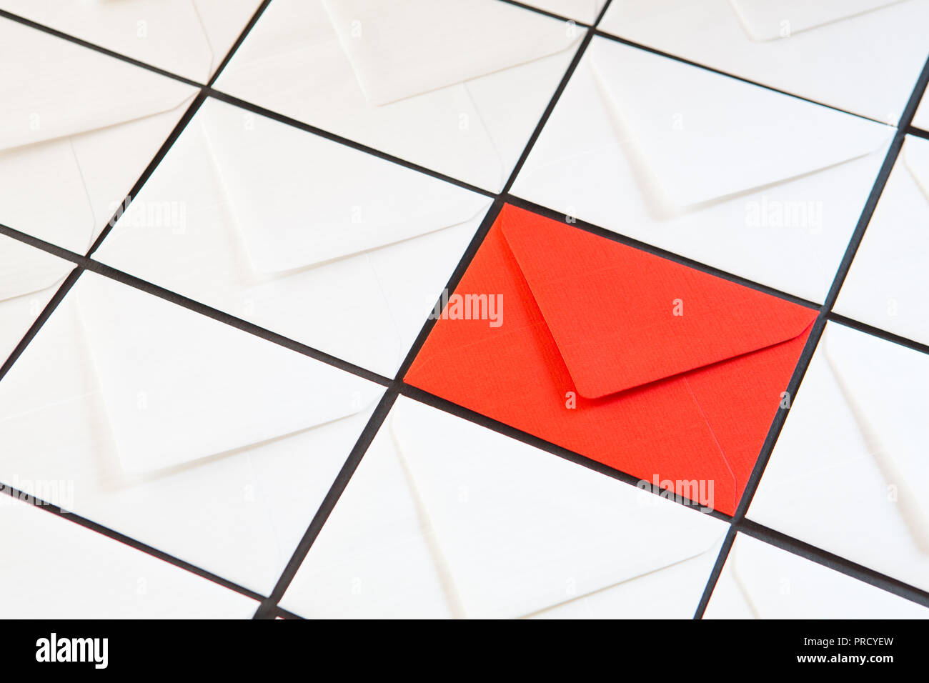 Composition with white and red  envelopes on the table. Different colored envelopes on the table. Stock Photo