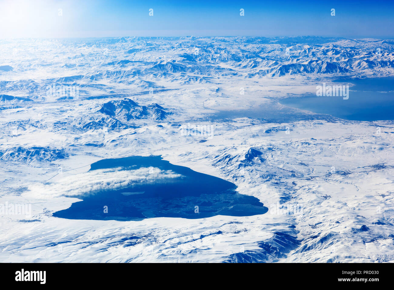 Aerial view of beautiful snowy landscape with frozen lake Stock Photo ...