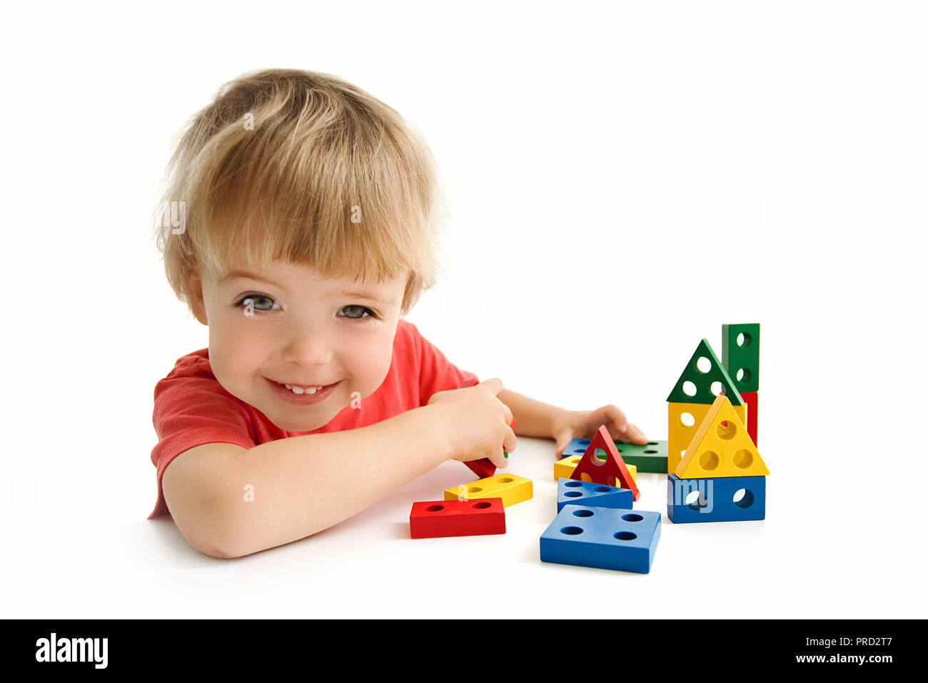 Cute boy building house isolated on white Stock Photo
