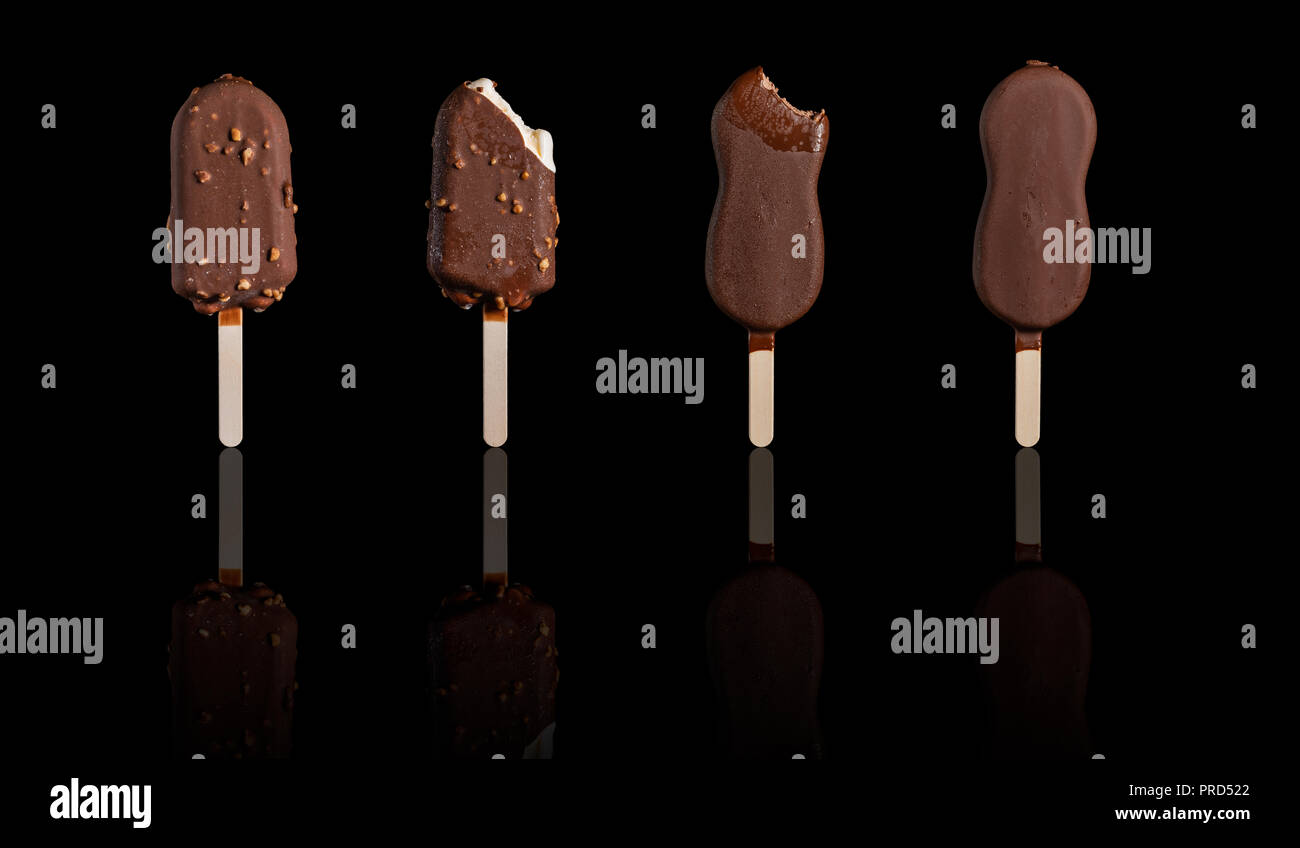 Ice cream bar with chocolate shell stand on the black reflective board