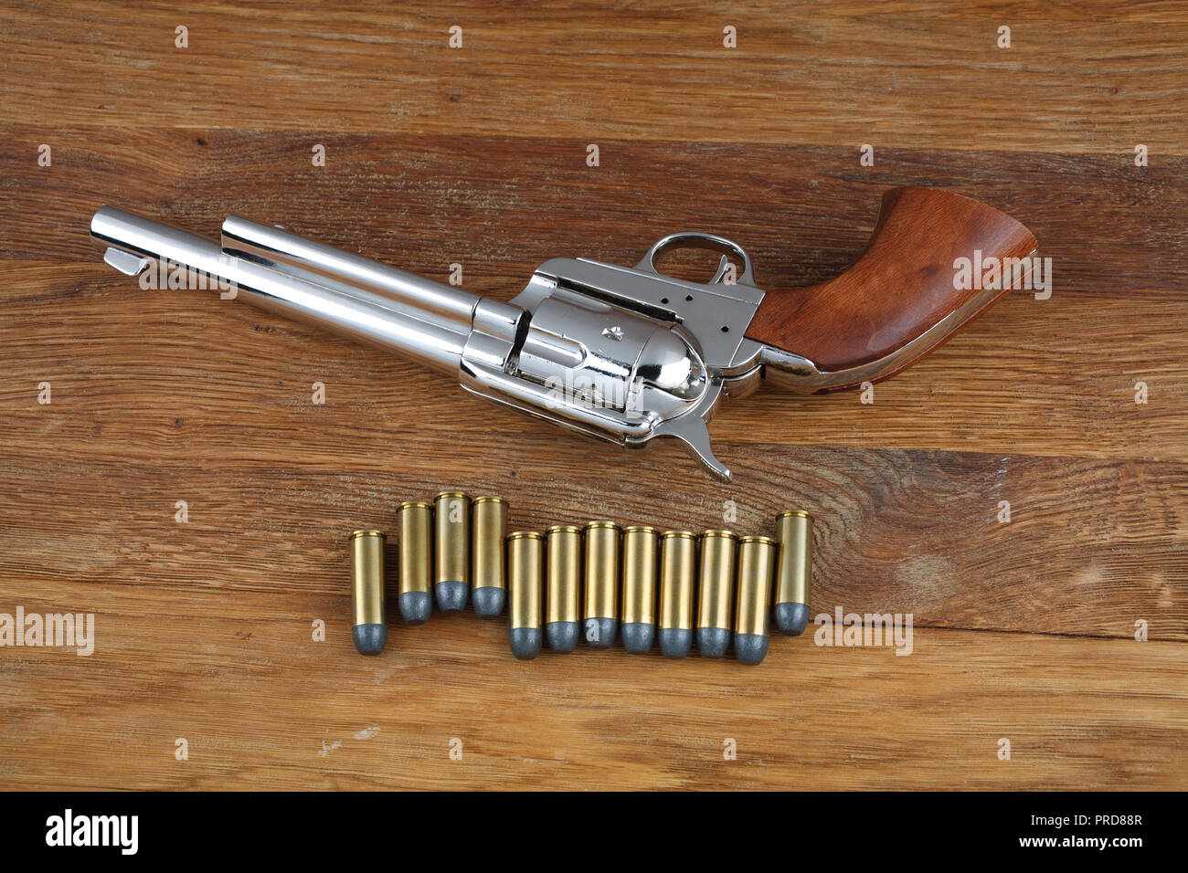 wild west revolver - colt single action army on wooden background Stock  Photo - Alamy