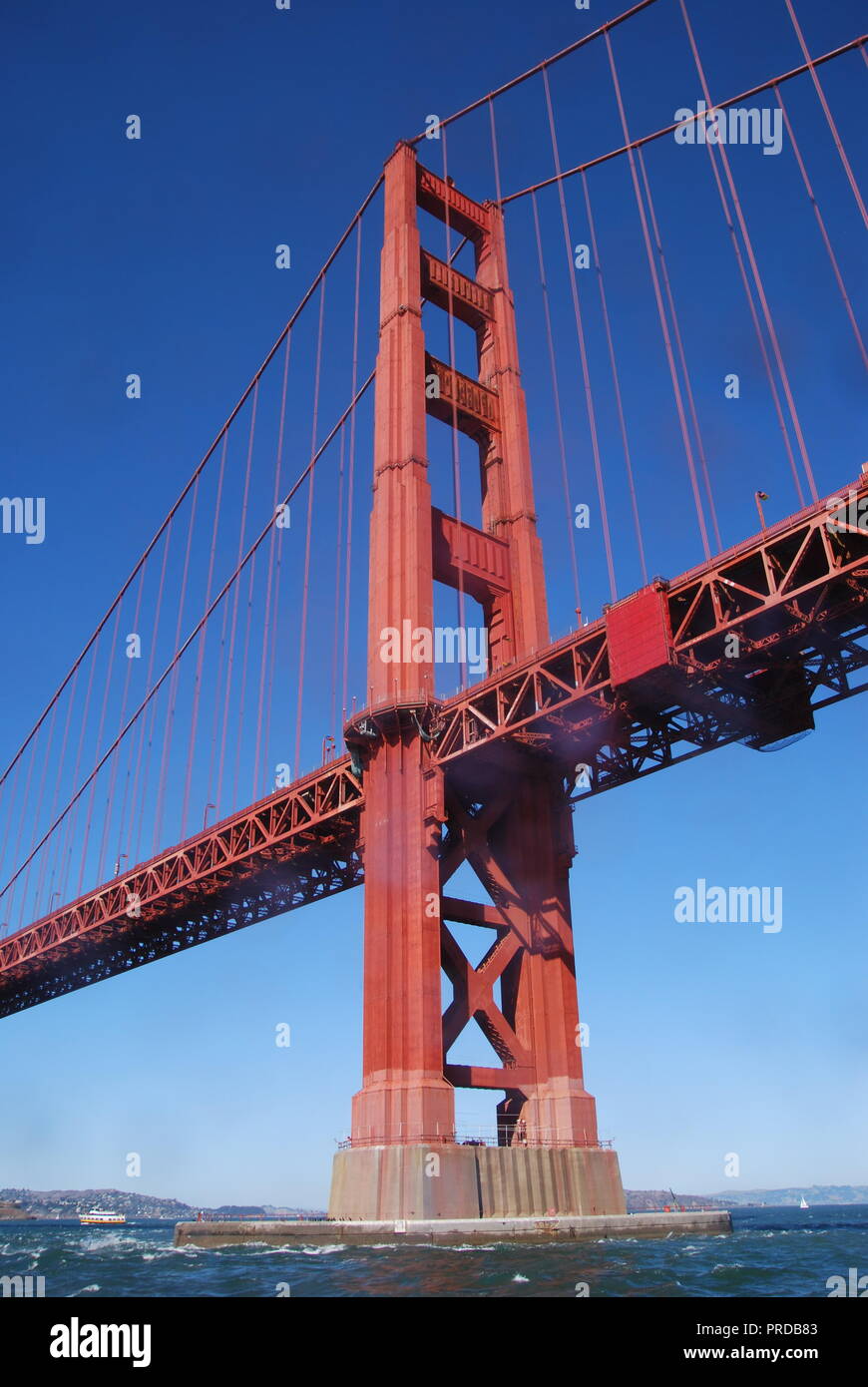 The 746-foot south tower of the Golden Gate Bridge photographed from the Pacific Ocean. San Francisco, California, USA. Stock Photo
