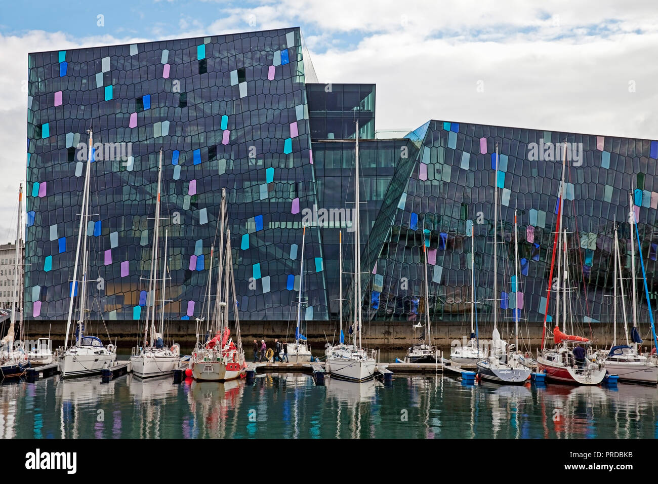 Harpa Concert Hall with marina, dichromatic glass facade with colour effects by Olafur Eliasson, Reykjavik, Iceland Stock Photo
