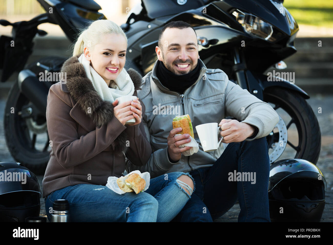 Young couple riding bikes and having fun in the city - Stock Image -  Everypixel