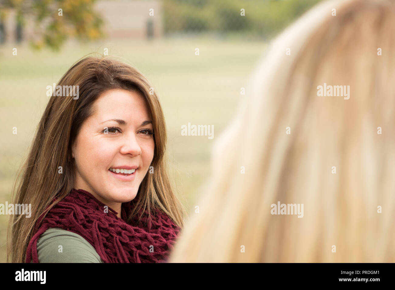 Older woman giving advice to a younger woman. Stock Photo