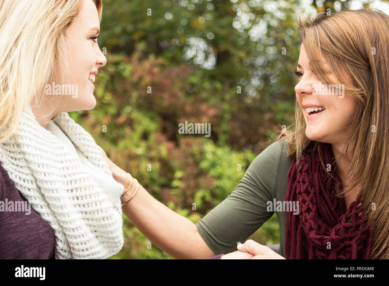 Older woman giving advice to a younger woman. Stock Photo